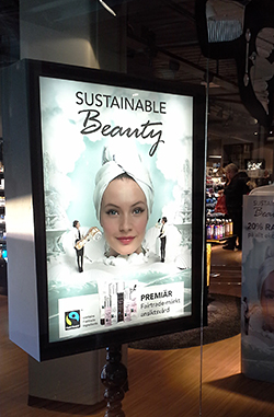 Skylt med reklam för Kicks Fairtrade-märkta hudvårdsserie på Kicks i Luleå